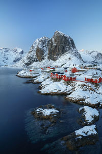 Scenic view of snowcapped mountains against blue sky