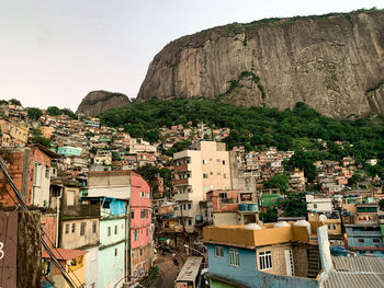 Buildings in city against clear sky