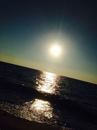 Scenic view of sea against clear sky during sunset