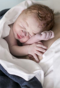 Newborn baby sleeping with mother, danderyd, stockholm, sweden