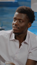 Portrait of young man looking away