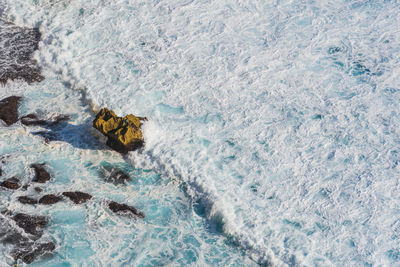 High angle view of waves in sea