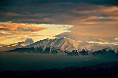 Scenic view of mountains against sky during sunset