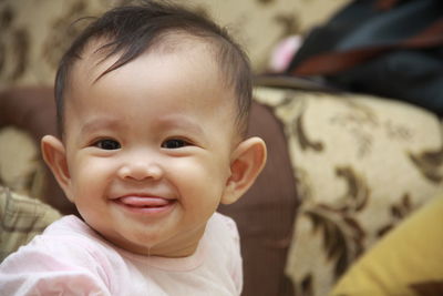 Portrait of cute baby boy smiling