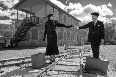 People standing on railroad track