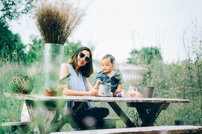 Friends and woman standing on plants