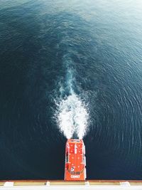 High angle view of boat sailing in sea