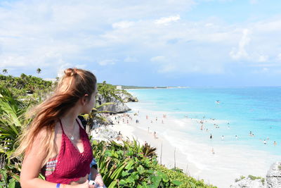 High angle view of woman standing against beach