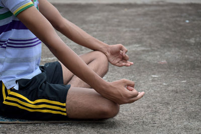 Low section of women sitting on floor