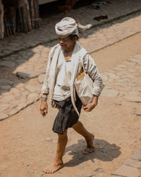 Full length of man walking on street