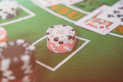 High angle view of gambling chips and cards on table