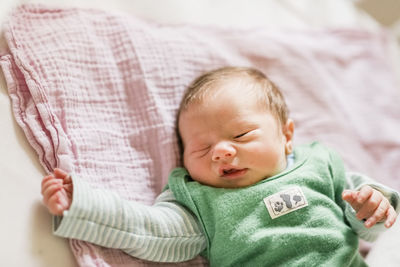 Cute baby sleeping on bed