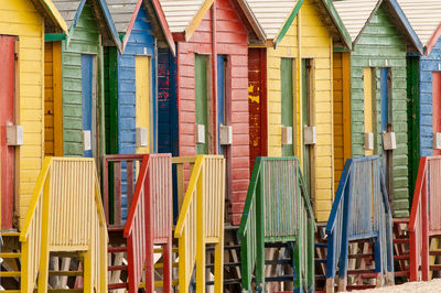 Colorful beach huts arranged in row