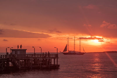 Scenic view of sea against orange sky