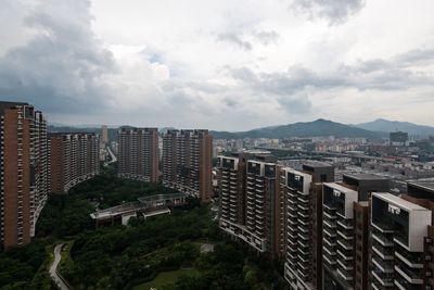 High angle view of buildings in city against sky