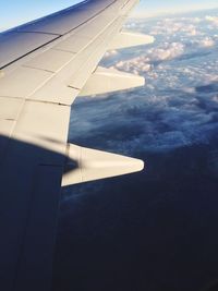 Airplane wing over landscape