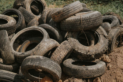 Close-up of abandoned tires at junkyard