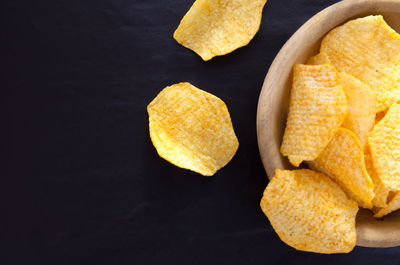 High angle view of potato chips in bowl on table