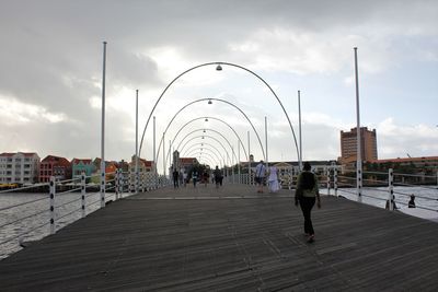 People at observation point against sky