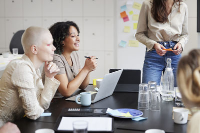 Group of business people attending business meeting in office