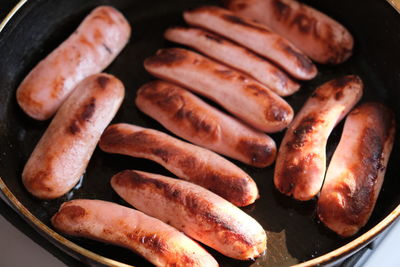 High angle view of meat on barbecue grill