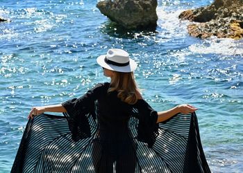 Woman wearing hat in sea