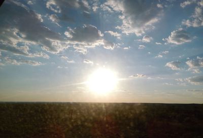 Sun shining through clouds