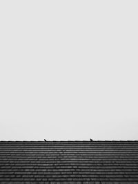 Low angle view of roof against clear sky