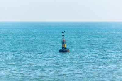 Scenic view of seascape against blue sky