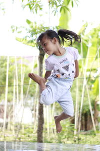 Portrait of boy playing with arms crossed