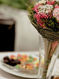 Close-up of flower vase on table