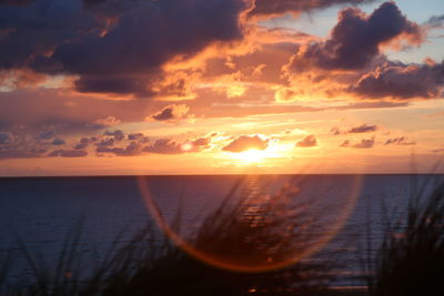 Scenic view of sea at sunset