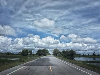 Road amidst landscape against sky