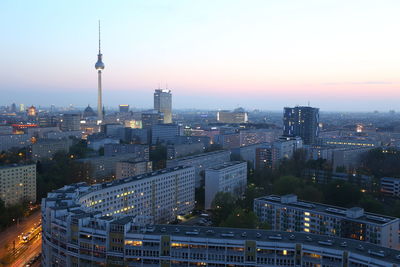 Cityscape against sky at sunset