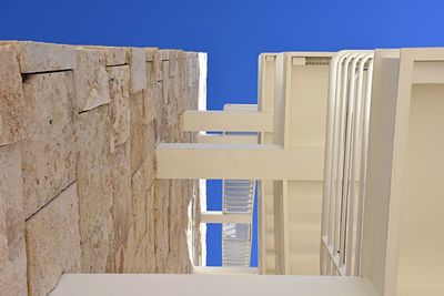 Low angle view of building against clear blue sky