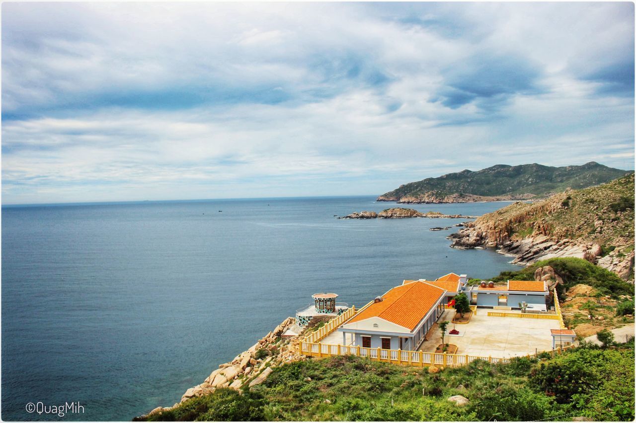 SCENIC VIEW OF SEA AGAINST BUILDINGS