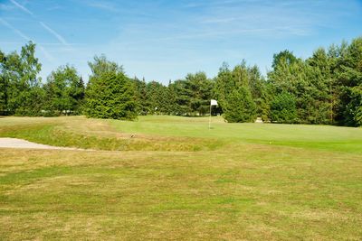 View of golf course against sky