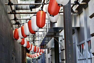 Close-up of hanging lanterns in alley