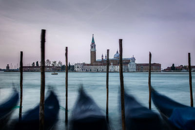 Panoramic view of sea and cityscape against sky