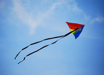 Low angle view of kite flying against sky