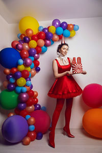 Portrait of woman with balloons