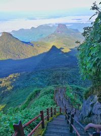 High angle view of footpath amidst mountains against sky