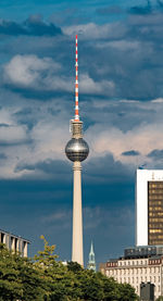 View of berlin tv tower against cloudy sky