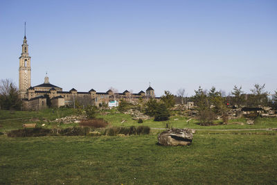 Built structure on field against clear sky