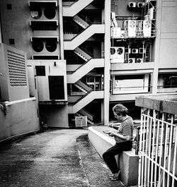 Full length of senior man in front of building