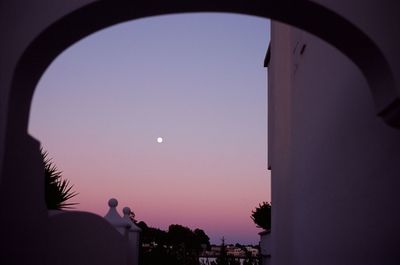 Low angle view of moon against clear sky