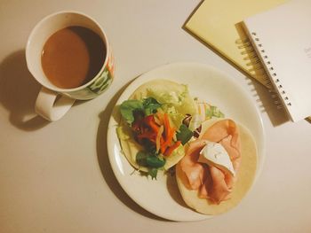 High angle view of coffee served on table