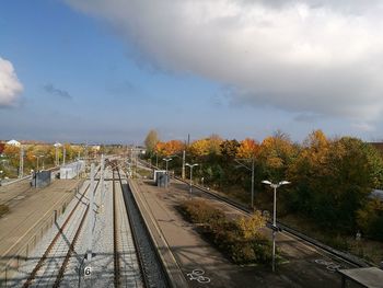 View of railway tracks along trees