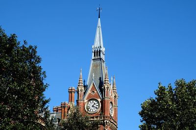 Low angle view of traditional building against clear blue sky