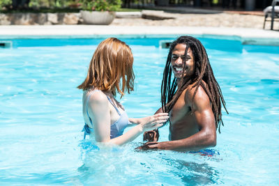 Young couple swimming in pool